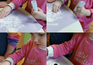 Dziewczynka siedzi przy stoliku i wykonuje pracę plastyczną "Niedźwiedź polarny".